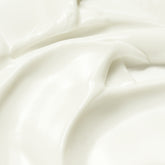 Close-up of white sun cream with folds