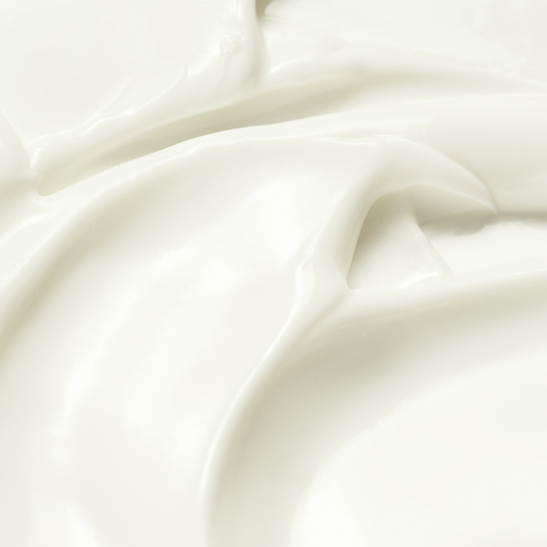 Close-up of white sun cream with folds