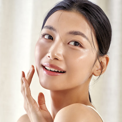 Woman with clear skin and a light-colored background