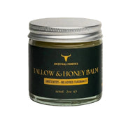 Tallow & Honey Balm jar with black label on a beige background